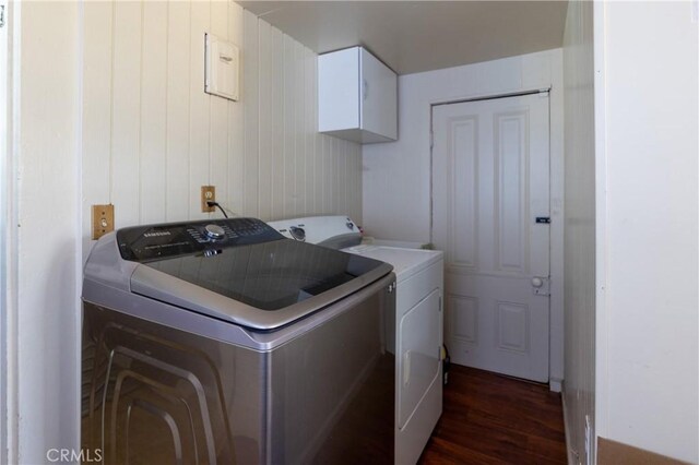 320 W 21st St, Merced, CA 95340 - washroom with washer and dryer, cabinet space, and dark wood-type flooring