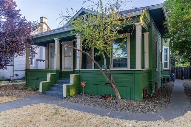 320 W 21st St, Merced, CA 95340 - shotgun-style home featuring covered porch and a chimney