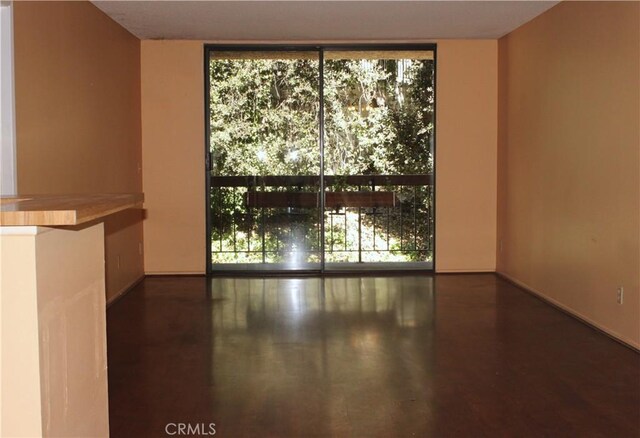 3961 Via Marisol Unit 233, Los Angeles, CA 90042 - unfurnished room featuring floor to ceiling windows and baseboards