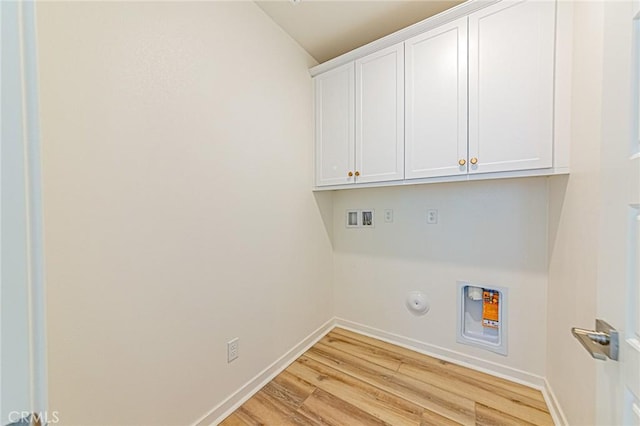 27505 Illumination Ct, Valencia, CA 91381 - laundry room with hookup for a washing machine, cabinet space, light wood-type flooring, and hookup for a gas dryer