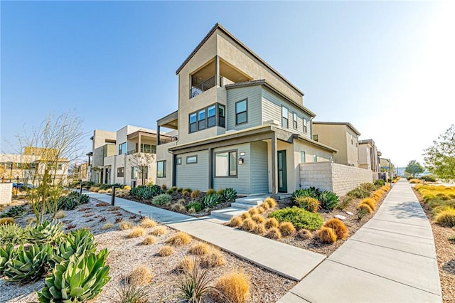 27505 Illumination Ct, Valencia, CA 91381 - view of front of property featuring stucco siding, a residential view, and a balcony