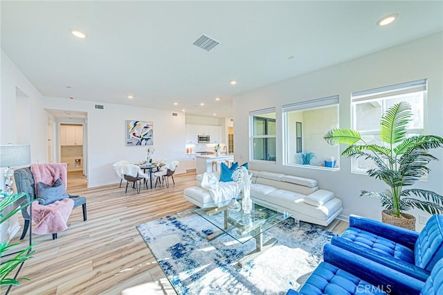27505 Illumination Ct, Valencia, CA 91381 - living room featuring light wood-style flooring and recessed lighting