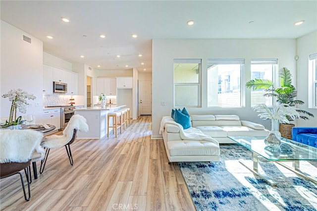 27505 Illumination Ct, Valencia, CA 91381 - living room with light wood-type flooring and recessed lighting