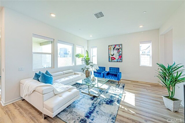 27505 Illumination Ct, Valencia, CA 91381 - living area featuring healthy amount of natural light, light wood finished floors, and recessed lighting