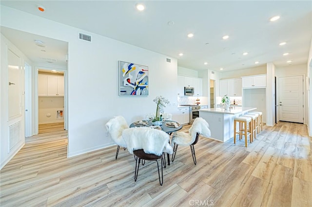 27505 Illumination Ct, Valencia, CA 91381 - dining room featuring light wood-type flooring and recessed lighting