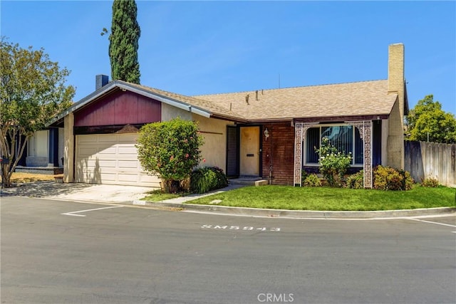 5943 Sky Meadow St, Jurupa Valley, CA 92509 - view of front facade with an attached garage, driveway, and a chimney