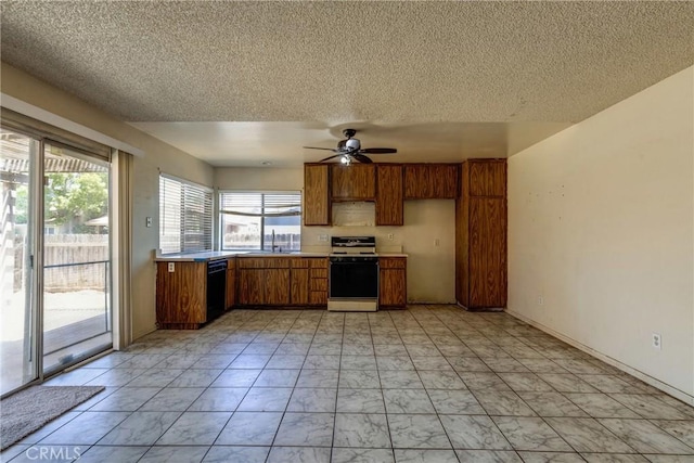 5943 Sky Meadow St, Jurupa Valley, CA 92509 - kitchen with gas range oven, brown cabinets, a textured ceiling, black dishwasher, and ceiling fan
