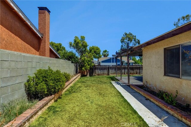 5943 Sky Meadow St, Jurupa Valley, CA 92509 - fenced backyard with a patio