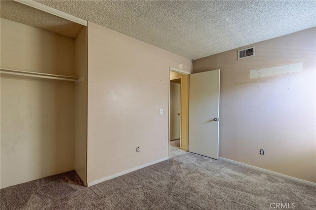 5943 Sky Meadow St, Jurupa Valley, CA 92509 - unfurnished bedroom with carpet flooring, a textured ceiling, and a closet