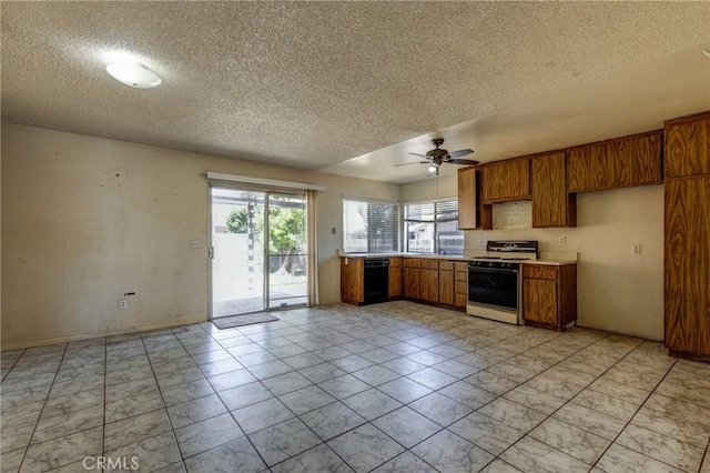 5943 Sky Meadow St, Jurupa Valley, CA 92509 - kitchen with white range oven, a textured ceiling, brown cabinets, a ceiling fan, and light countertops