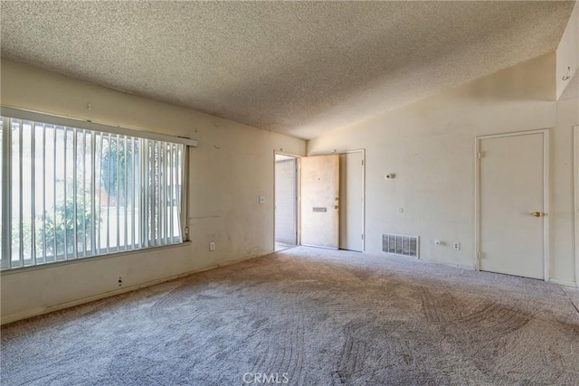 5943 Sky Meadow St, Jurupa Valley, CA 92509 - carpeted empty room with a textured ceiling and vaulted ceiling