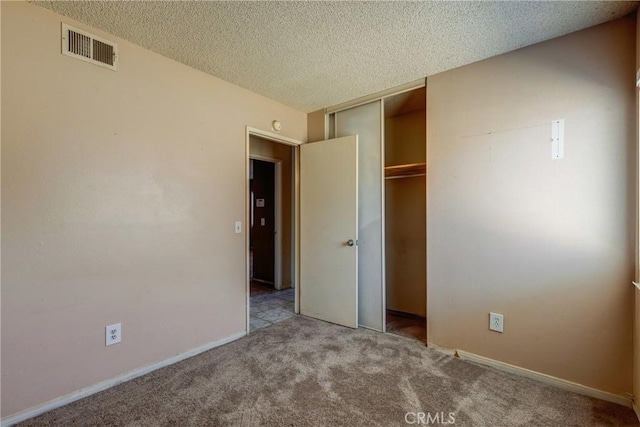 5943 Sky Meadow St, Jurupa Valley, CA 92509 - unfurnished bedroom featuring carpet, a closet, and a textured ceiling