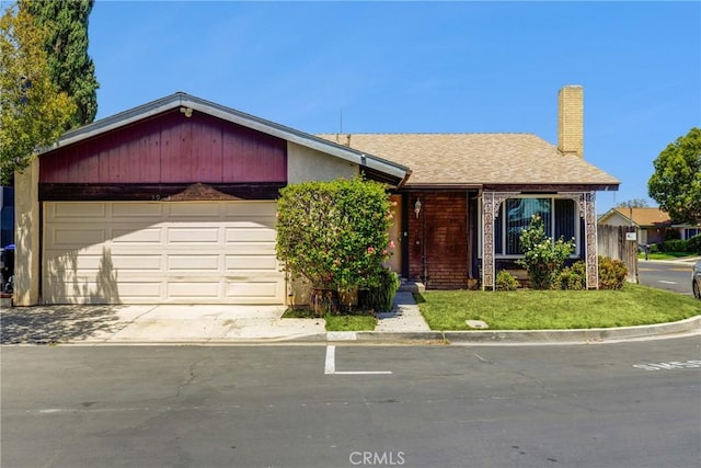 5943 Sky Meadow St, Jurupa Valley, CA 92509 - view of front of home featuring an attached garage, a chimney, and concrete driveway