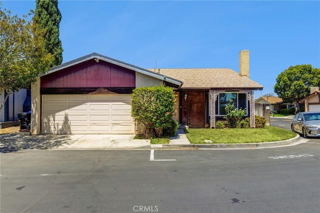 5943 Sky Meadow St, Jurupa Valley, CA 92509 - view of front of home featuring a chimney, a garage, and concrete driveway