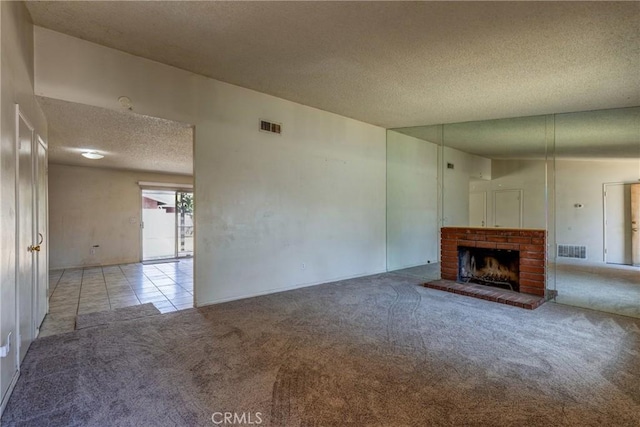 5943 Sky Meadow St, Jurupa Valley, CA 92509 - unfurnished living room with a textured ceiling, carpet flooring, a fireplace, and tile patterned flooring