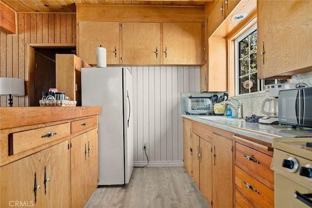 33712 Green Valley Lake Rd, Green Valley Lake, CA 92341 - kitchen featuring freestanding refrigerator, light wood-type flooring, light countertops, wood walls, and wooden ceiling