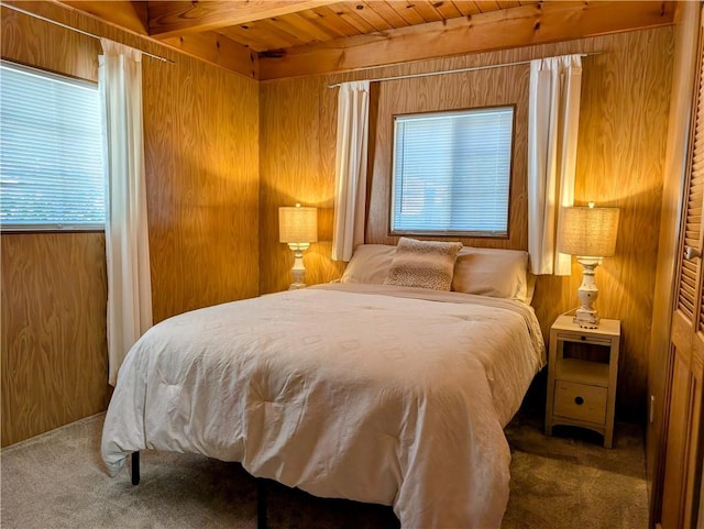 33712 Green Valley Lake Rd, Green Valley Lake, CA 92341 - bedroom featuring carpet floors, wooden walls, and a wood ceiling with exposed beams