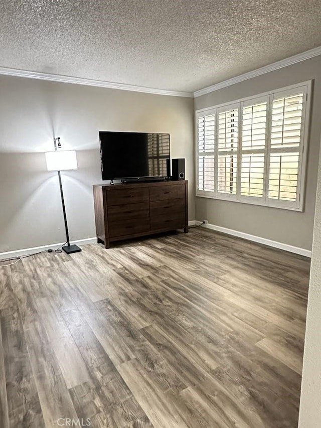 2200 Woodside Ln Unit 2, Sacramento, CA 95825 - unfurnished living room with ornamental molding, a textured ceiling, and wood finished floors