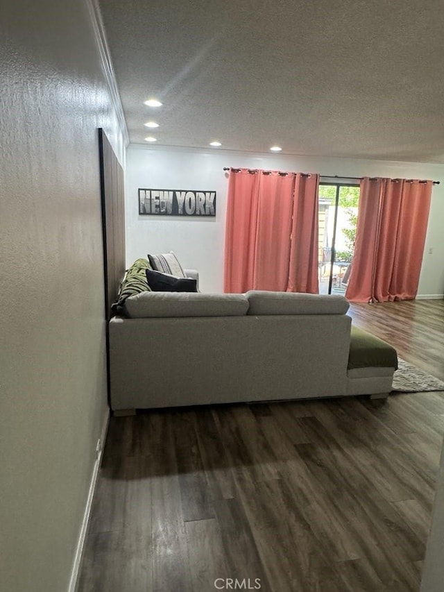 2200 Woodside Ln Unit 2, Sacramento, CA 95825 - living area with dark wood-style floors, a textured ceiling, and recessed lighting