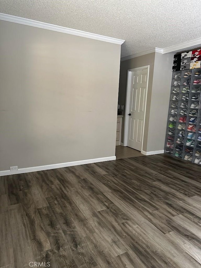 2200 Woodside Ln Unit 2, Sacramento, CA 95825 - spare room with a textured ceiling, dark wood-type flooring, and ornamental molding