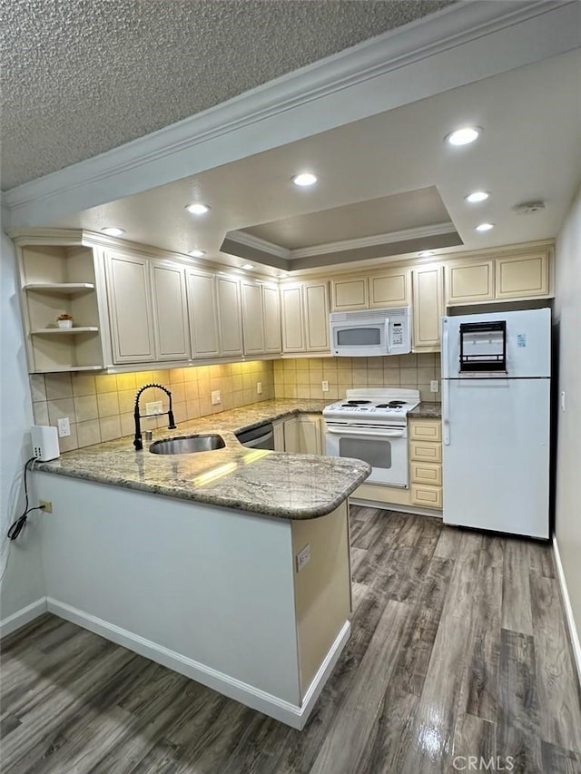 2200 Woodside Ln Unit 2, Sacramento, CA 95825 - kitchen featuring white appliances, ornamental molding, a peninsula, open shelves, and dark wood finished floors