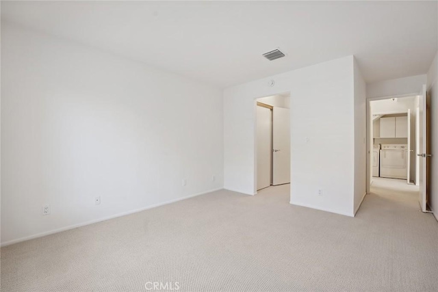 4240 Lost Hills Rd Unit 2205, Calabasas, CA 91301 - empty room with washing machine and clothes dryer and light carpet