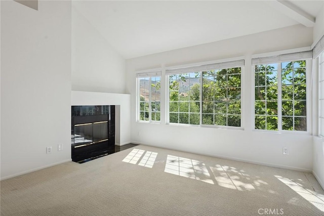 4240 Lost Hills Rd Unit 2205, Calabasas, CA 91301 - unfurnished living room with carpet flooring, a tiled fireplace, and high vaulted ceiling