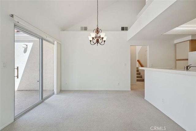4240 Lost Hills Rd Unit 2205, Calabasas, CA 91301 - spare room with a chandelier, light carpet, stairs, and high vaulted ceiling