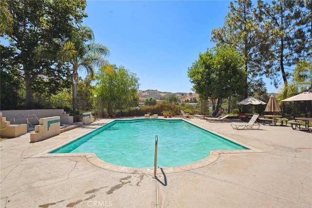 4240 Lost Hills Rd Unit 2205, Calabasas, CA 91301 - view of swimming pool with a patio area