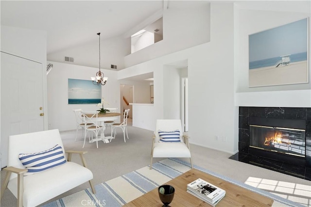 4240 Lost Hills Rd Unit 2205, Calabasas, CA 91301 - carpeted living room with vaulted ceiling, a chandelier, and a fireplace