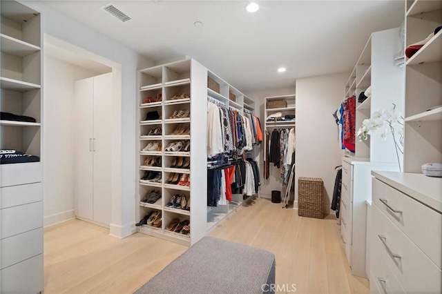 16 Seawatch, Newport Coast, CA 92657 - walk in closet featuring light wood-type flooring