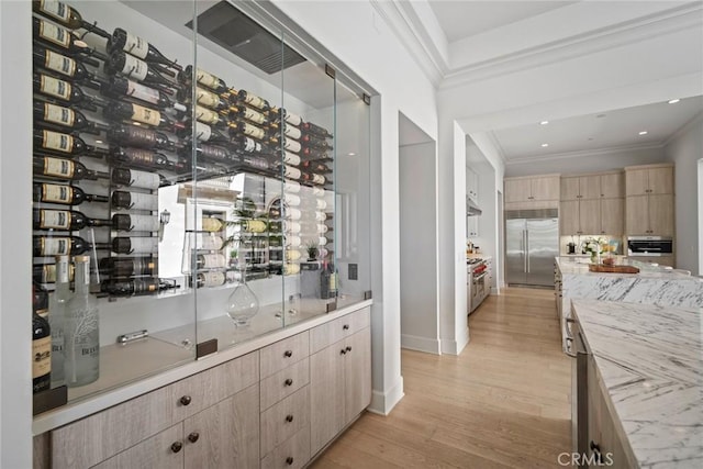 16 Seawatch, Newport Coast, CA 92657 - wine area featuring ornamental molding, light wood-type flooring, and recessed lighting