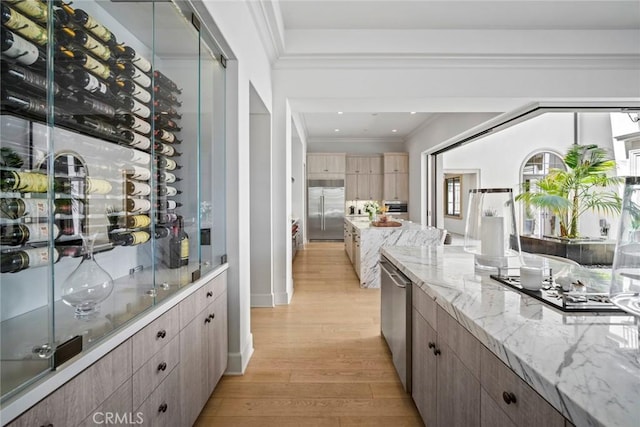16 Seawatch, Newport Coast, CA 92657 - wine room with light wood-style flooring, ornamental molding, and recessed lighting