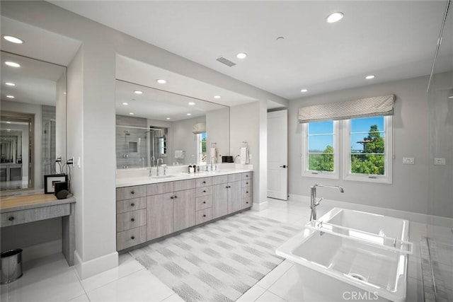 16 Seawatch, Newport Coast, CA 92657 - full bathroom with healthy amount of natural light, double vanity, a freestanding tub, recessed lighting, and a stall shower