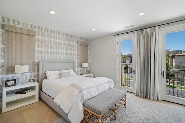 16 Seawatch, Newport Coast, CA 92657 - bedroom featuring access to exterior, recessed lighting, wood finished floors, and wallpapered walls