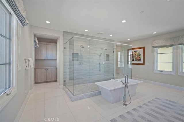 16 Seawatch, Newport Coast, CA 92657 - full bath featuring a shower stall, a freestanding bath, recessed lighting, and tile patterned floors