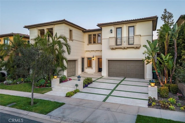 16 Seawatch, Newport Coast, CA 92657 - mediterranean / spanish-style home featuring a balcony, an attached garage, driveway, stucco siding, and a tiled roof