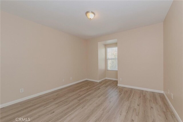 25228 Coral Canyon Rd, Corona, CA 92883 - spare room with light wood finished floors and baseboards