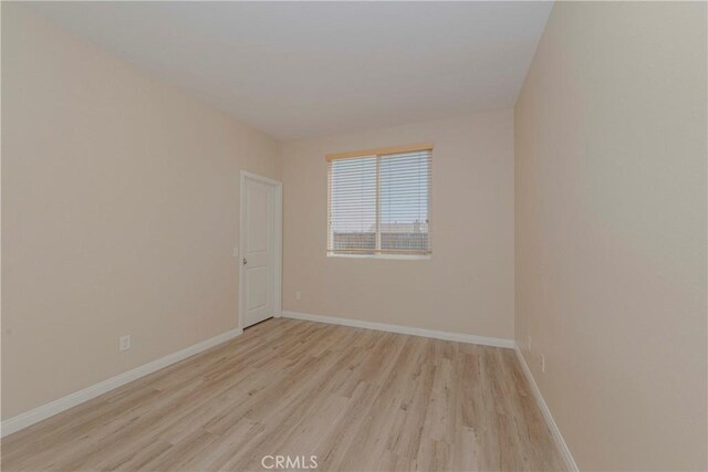 25228 Coral Canyon Rd, Corona, CA 92883 - spare room with light wood-type flooring and baseboards