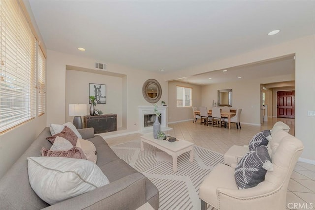 25228 Coral Canyon Rd, Corona, CA 92883 - living area featuring light tile patterned floors and recessed lighting