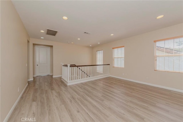 25228 Coral Canyon Rd, Corona, CA 92883 - empty room with light wood finished floors and recessed lighting