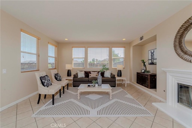 25228 Coral Canyon Rd, Corona, CA 92883 - living room with light tile patterned flooring, recessed lighting, and a glass covered fireplace