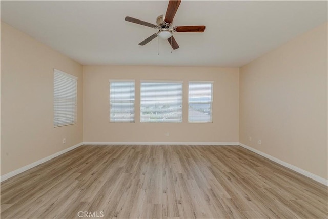 25228 Coral Canyon Rd, Corona, CA 92883 - spare room featuring light wood-style flooring and a ceiling fan