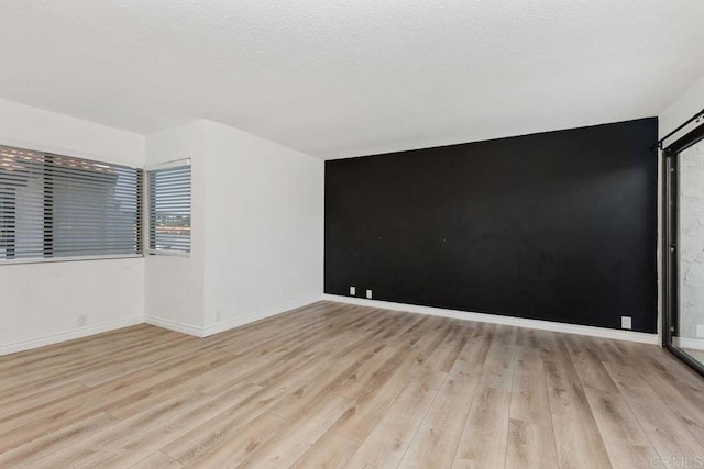 7528 Jerez Ct Unit 6, Carlsbad, CA 92009 - unfurnished room with light wood-style floors
