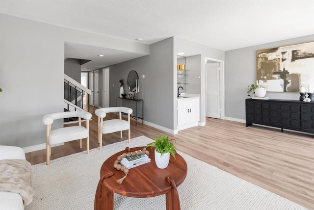 7528 Jerez Ct Unit 6, Carlsbad, CA 92009 - living area with light wood finished floors and stairs