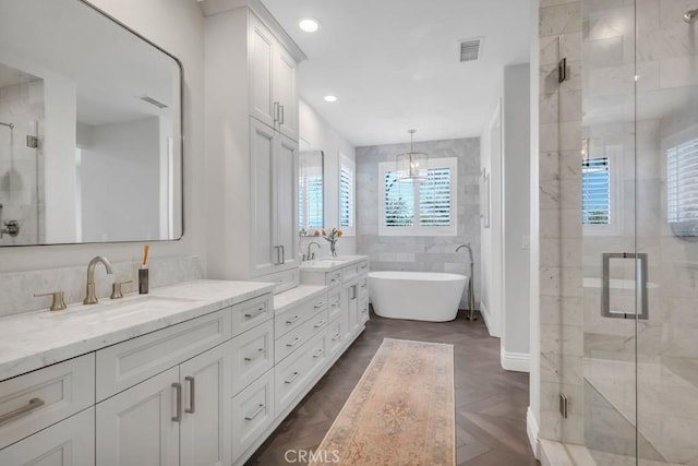24234 Reyes Adobe Way, Valencia, CA 91354 - bathroom with double vanity, a shower stall, and a freestanding bath