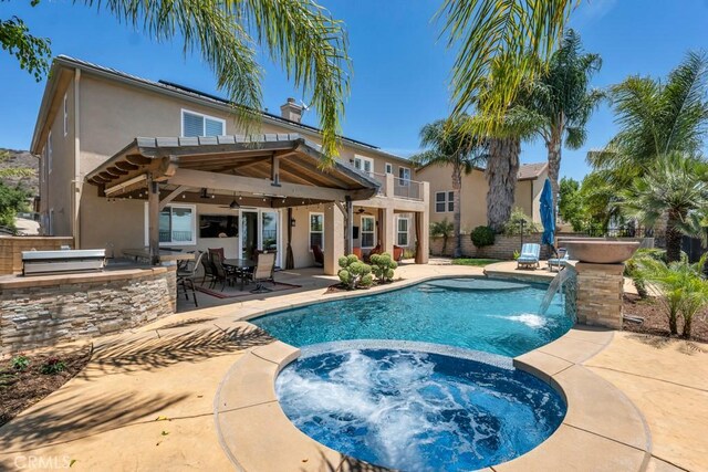 24234 Reyes Adobe Way, Valencia, CA 91354 - view of pool featuring area for grilling, a ceiling fan, a pool with connected hot tub, and a patio
