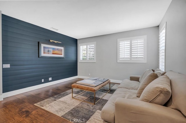 24234 Reyes Adobe Way, Valencia, CA 91354 - living area with an accent wall and wood finished floors