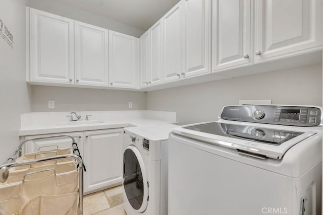 24234 Reyes Adobe Way, Valencia, CA 91354 - laundry room with washing machine and clothes dryer and cabinet space