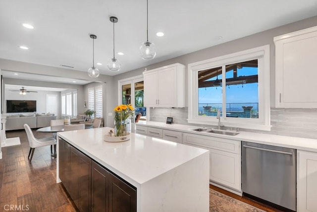 24234 Reyes Adobe Way, Valencia, CA 91354 - kitchen with dishwasher, recessed lighting, open floor plan, backsplash, and light countertops